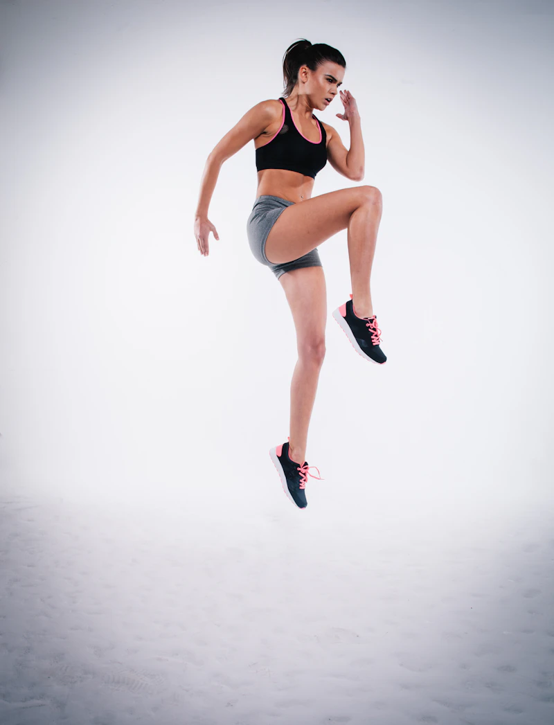 Athlete working through a set on the gym floor with visible focus and effort