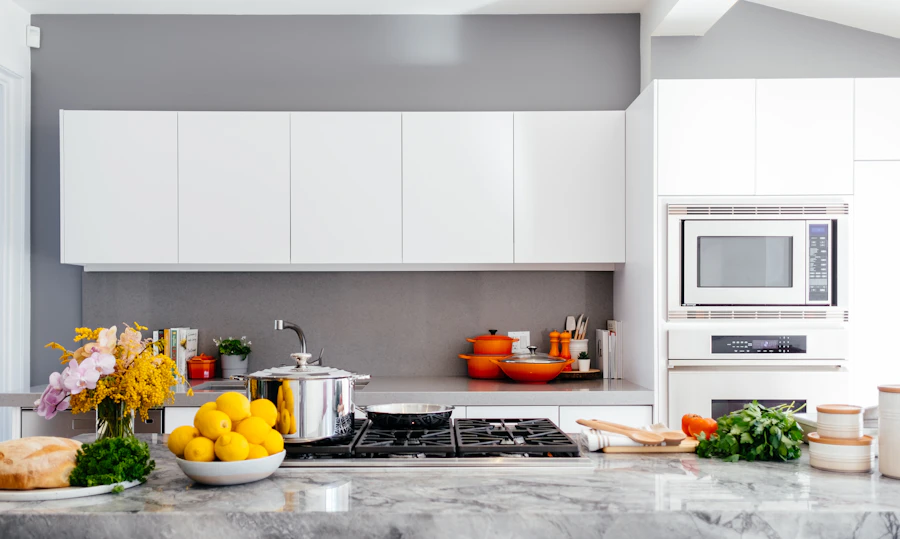 Luxury kitchen interior with stone benchtop and pendant lighting — 21 Hedges Avenue, Mermaid Beach