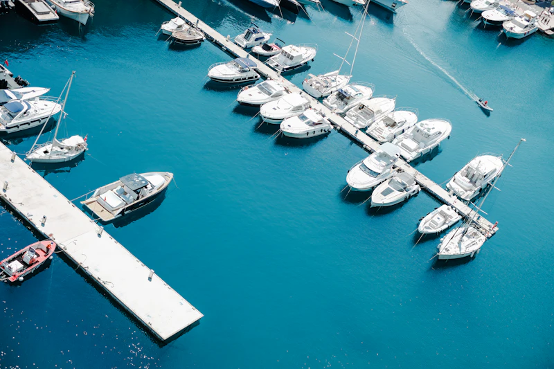 Coastal marina with waterfront homes and moored boats