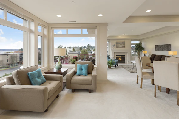 Light-filled living room with neutral furnishings — 3 The Corso, Burleigh Heads