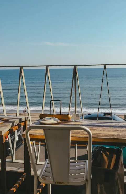 Ocean-view deck seating at sunrise